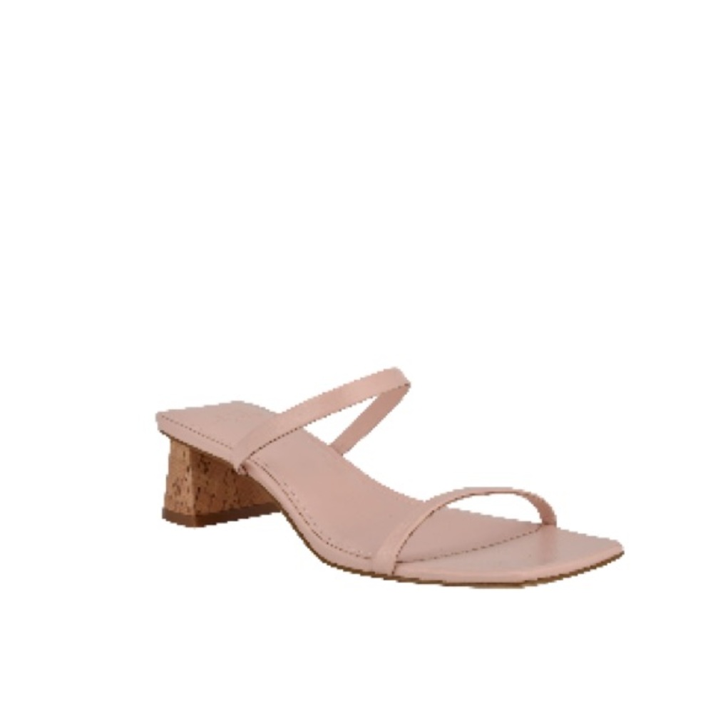 sandal with cork detailing and a chunky flared heal. 2 inches